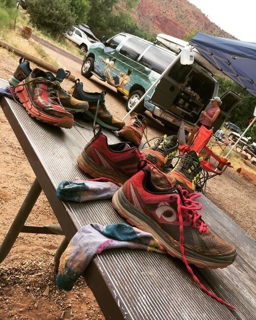 Packing organization at picnic table at campsite