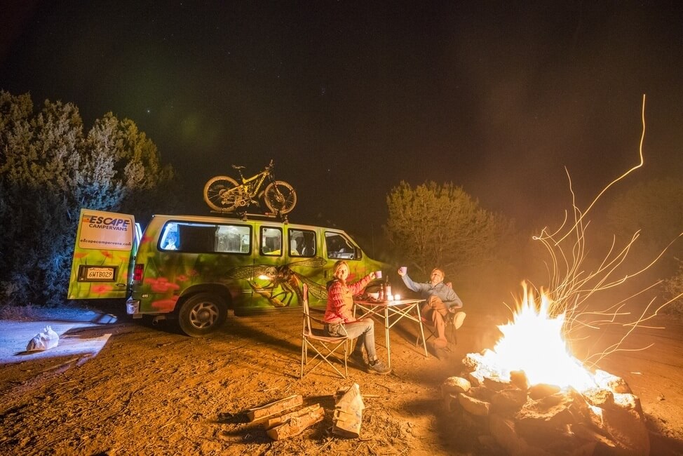 Cheers by the campfire campervan