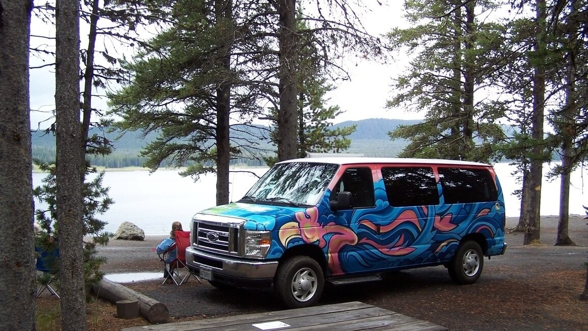 Escape campervan in Yellowstone National Park by the lake