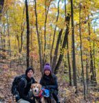 Fall foliage in Virginia couple and dog