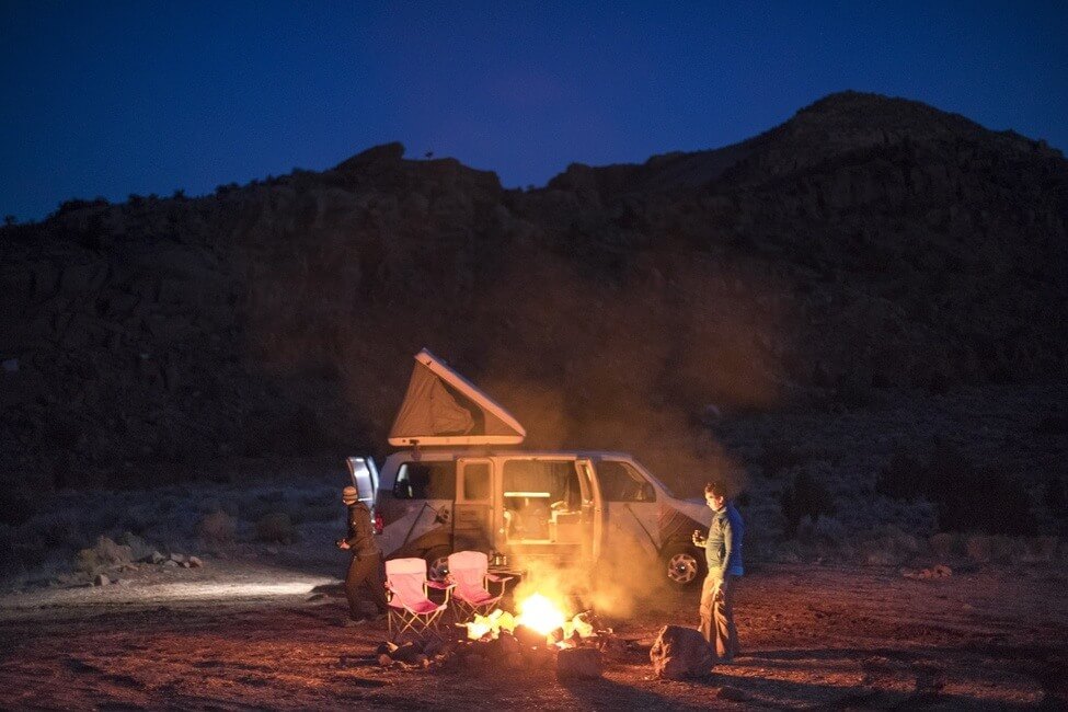 Campervan camping by the fire