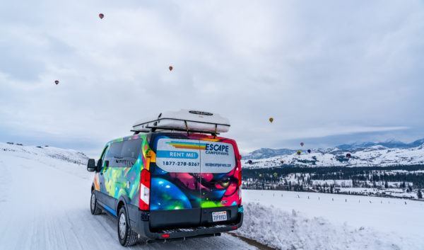 Campervan in snowy mountains
