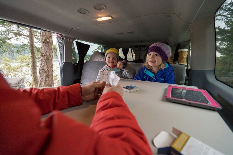 Playing cards on a road trip in a campervan