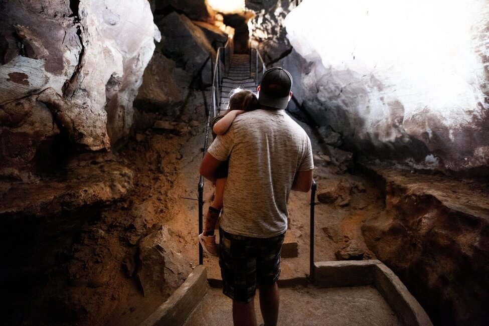 Diamond Cave dad carrying daughter