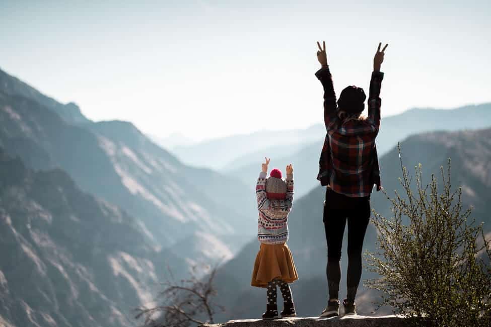 mother and daughter on mountain vista