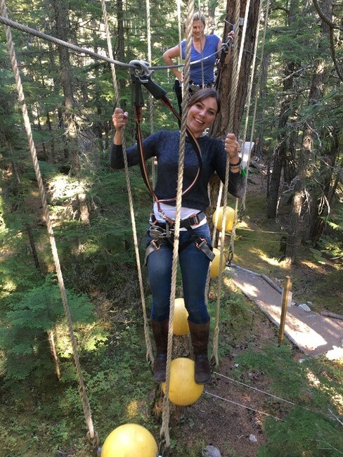 Couple on a tree top adventure walk