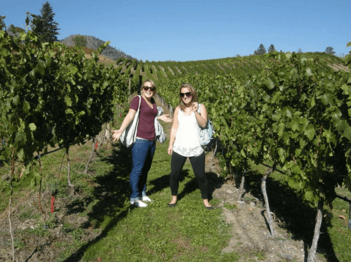 Women standing in a vineyard