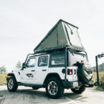 jeep camper exterior with rooftop sleeper and bike rack