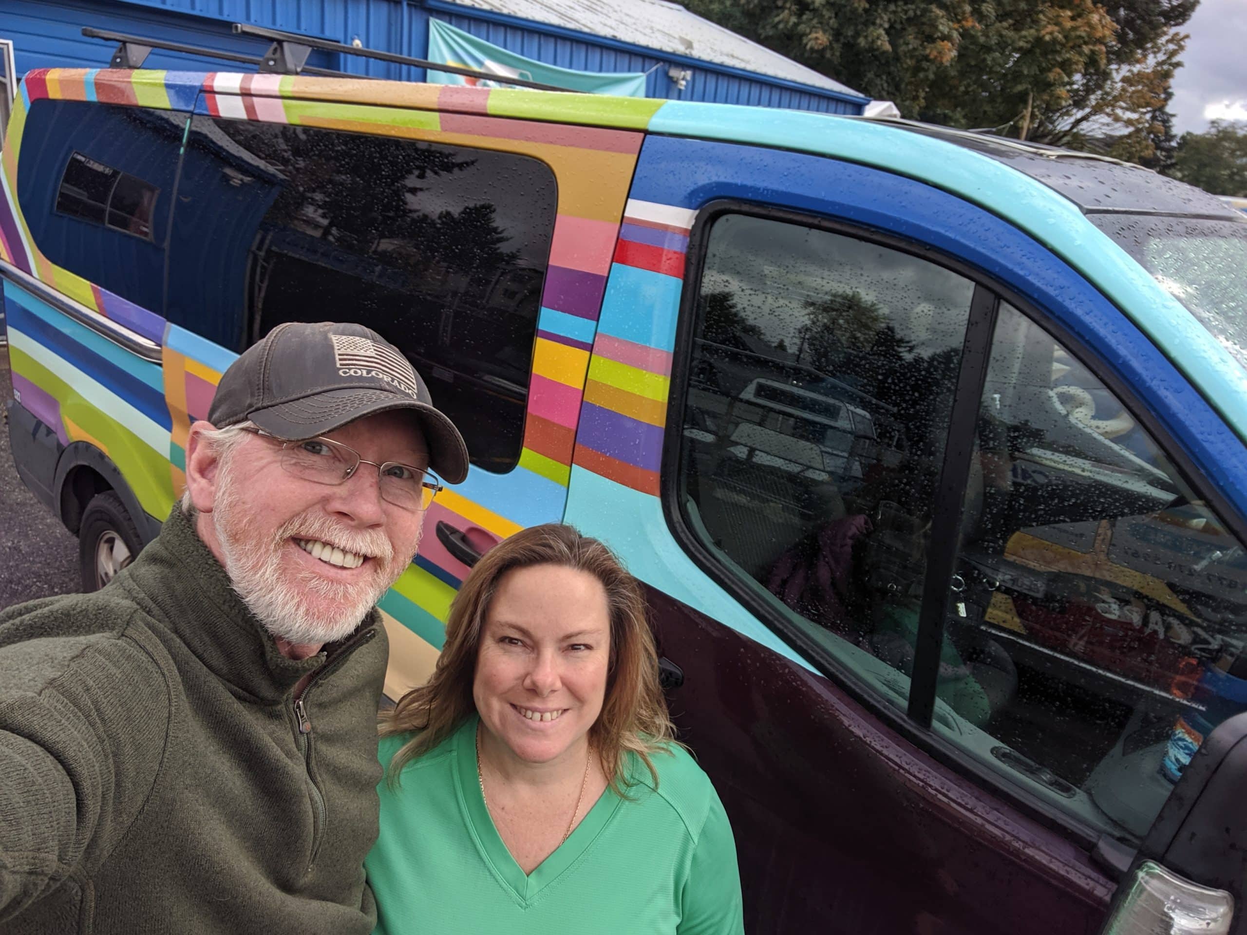 Couple in front of an Escape campervan