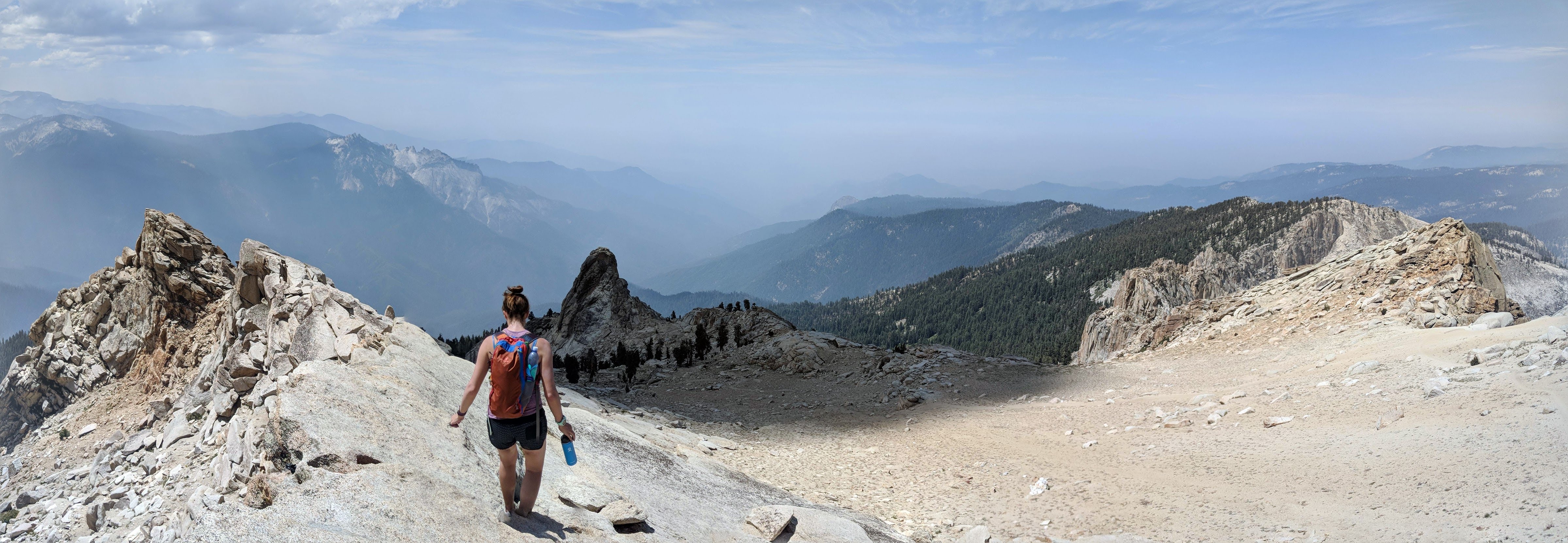 Woman standing on the Alta Peak Summit