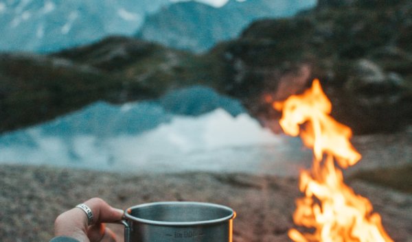 Campfire and coffee mug.