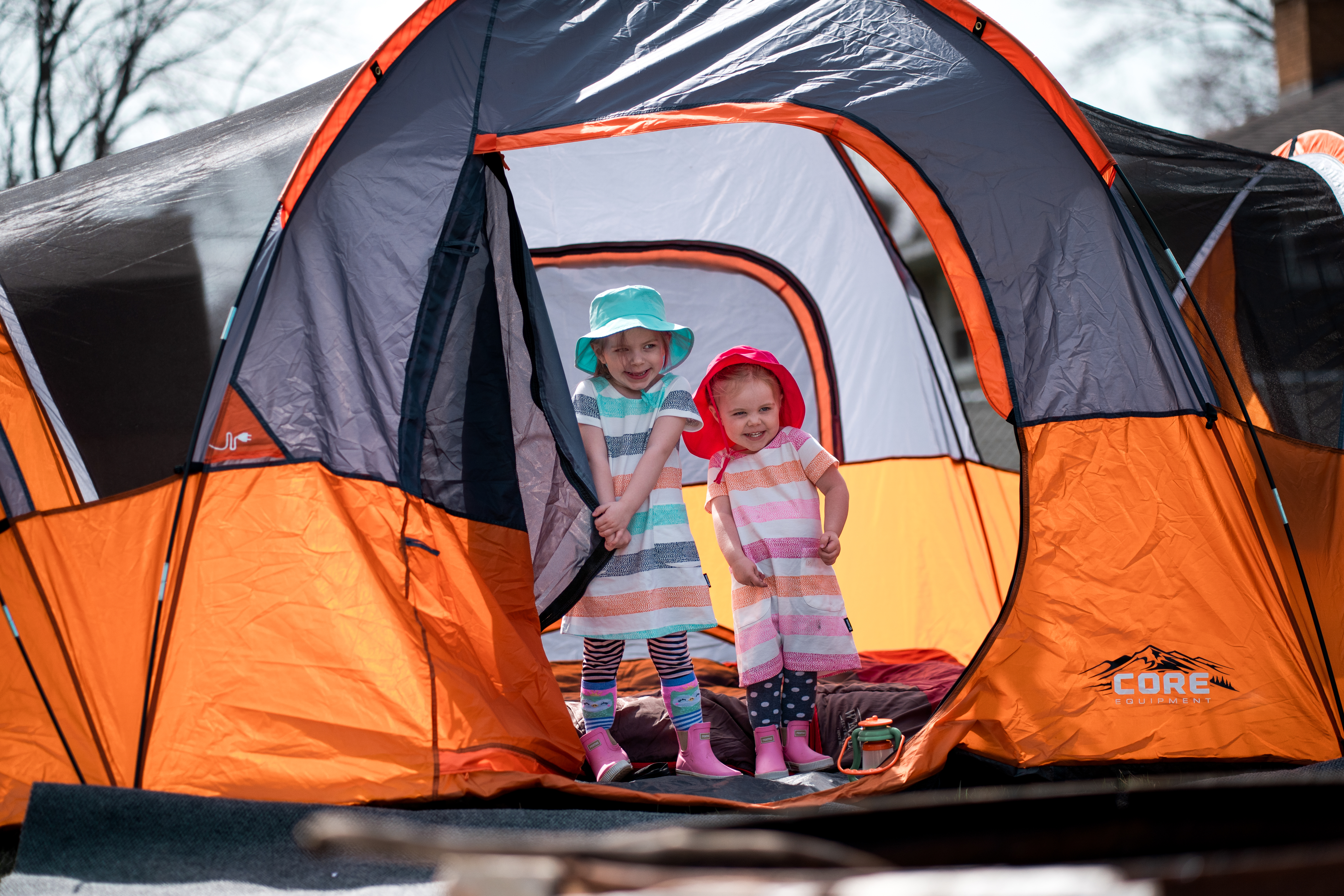 Kids camping in a backyard.