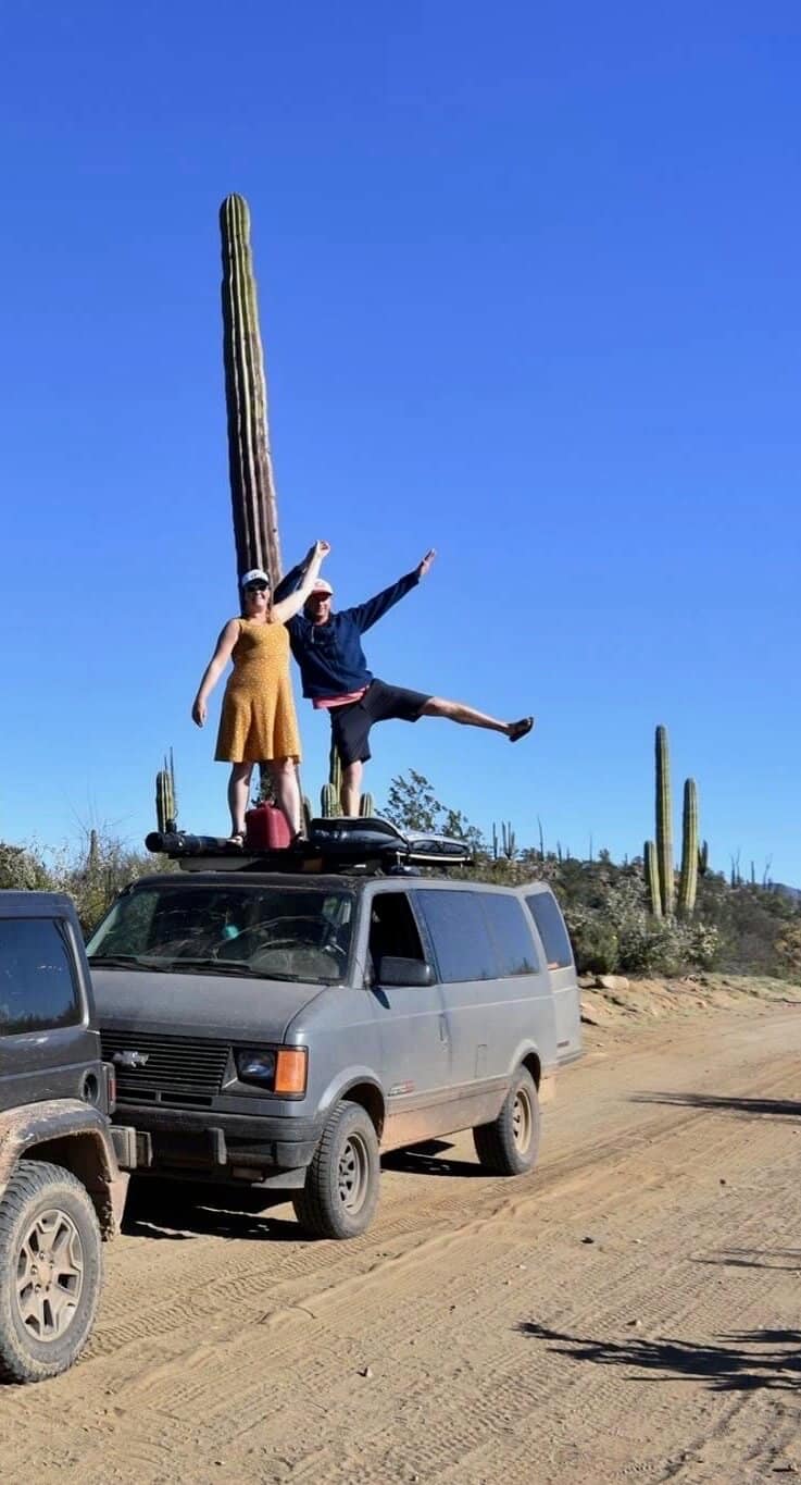 Couple on top of a campervan