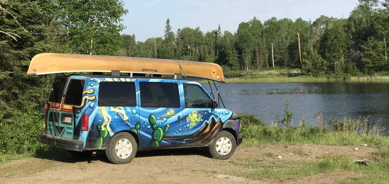 Campervan with a canoe on top