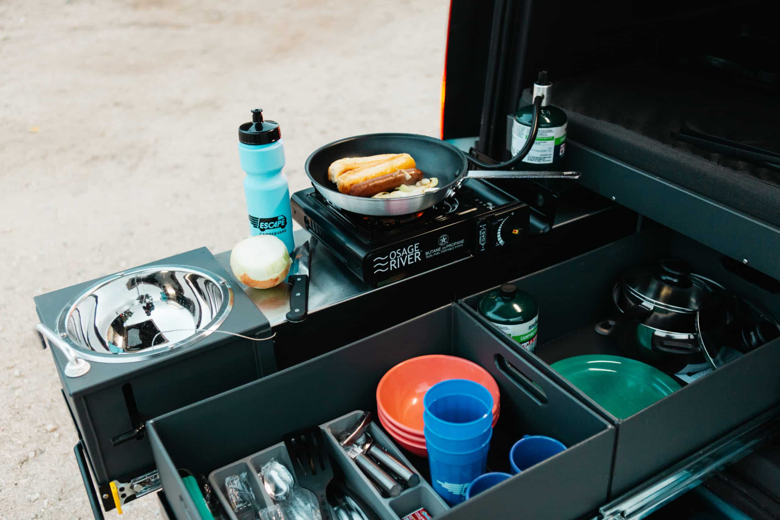 You can cook in the back of you Escape Camper Van on your California desert road trip.