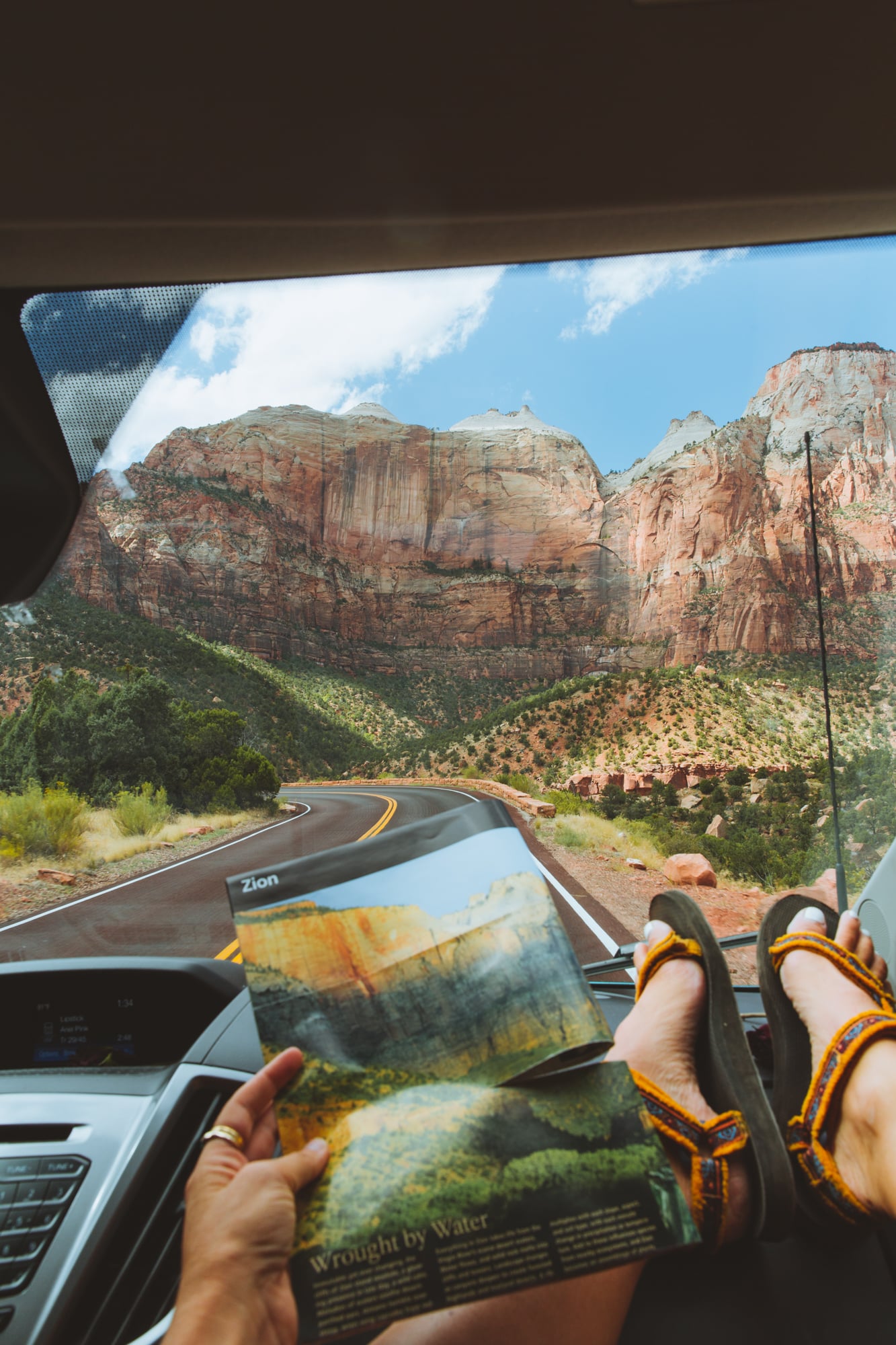A person holding a map while in Zion National Park.