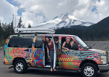 Camper van in front of Mt Hood on its way from Portland to Crater Lake