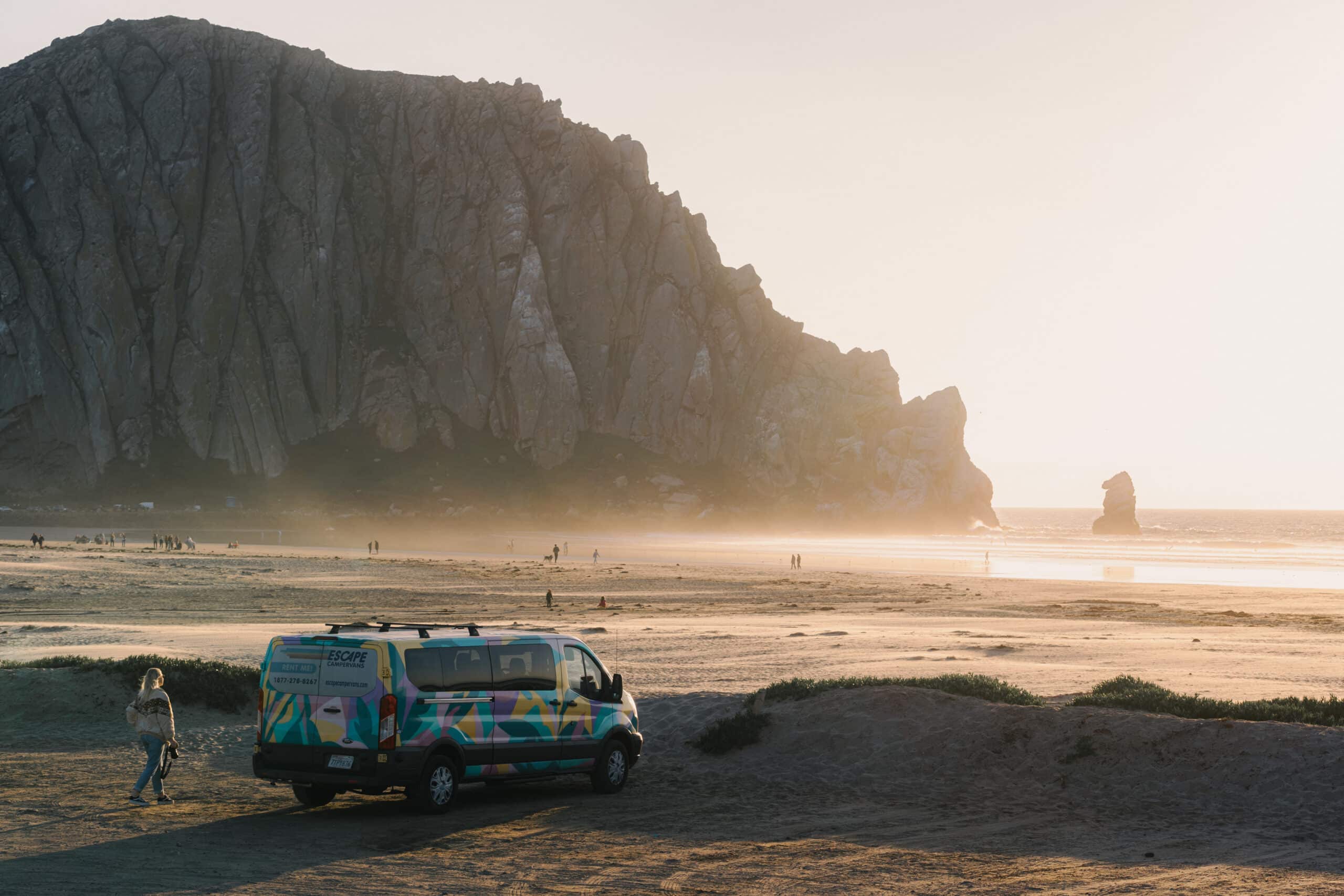 An Escape camper van parked by a California beach. A camper van is the best way to experience a Pacific Coast highway road trip.